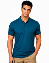 Load image into Gallery viewer, Man wearing a blue bamboo polo shirt 
