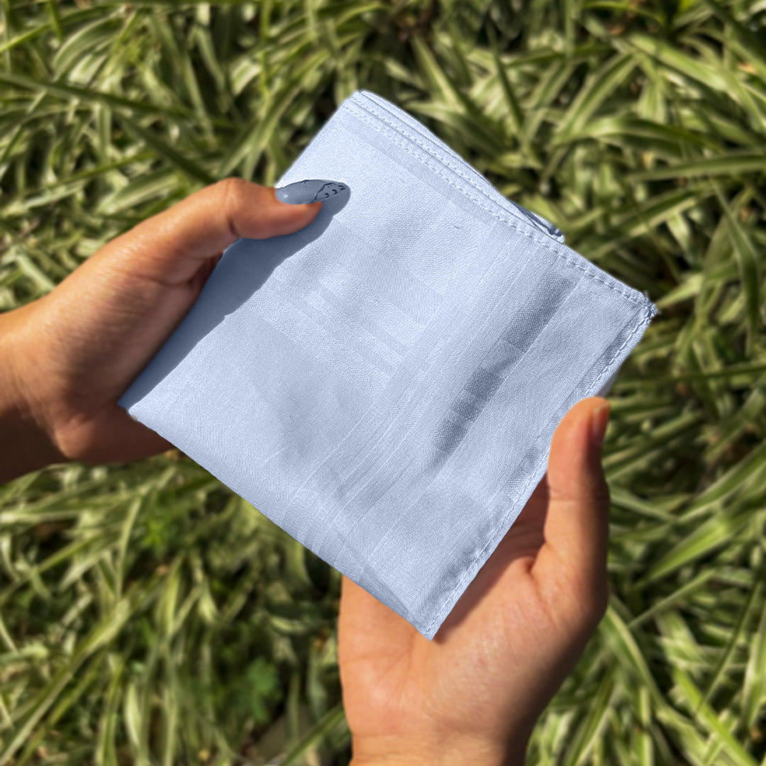 Magnified view of the stitched light blue handkerchief border
