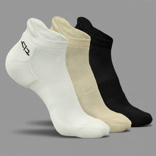 Load image into Gallery viewer, Three pairs of socks in white, beige, and black on a dark gray background
